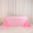 Pink tablecloth draped elegantly over a table in a studio setting.