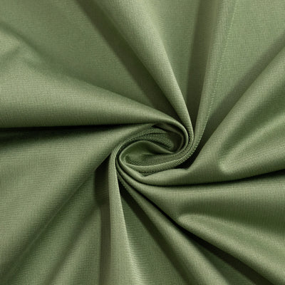Green fabric texture in a spiral pattern.