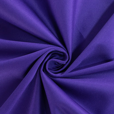 Purple fabric swirl showcasing smooth texture and vibrant color.