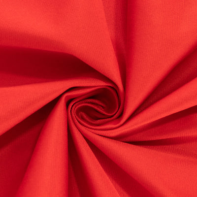 Red fabric texture showcasing a smooth, swirling pattern.