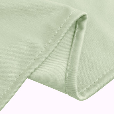 Light green fabric with fine stitching details.