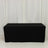 Black table cover draped over a rectangular table in studio setting.