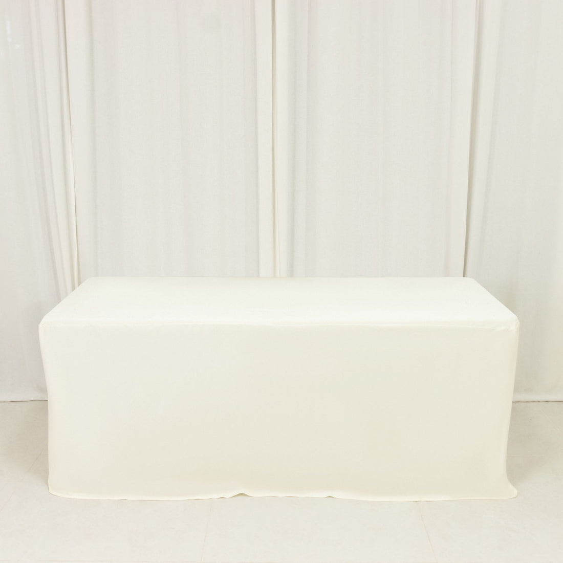 White table cover draped over a rectangular table