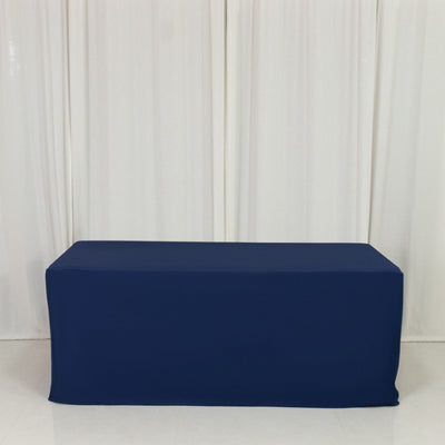 Navy blue table cover on a plain backdrop