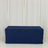 Navy blue table cover on a plain backdrop