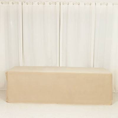 Beige table cover on a plain backdrop