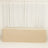 Beige table cover on a plain backdrop