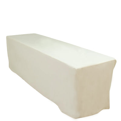 Long rectangular table covered with a soft beige tablecloth.