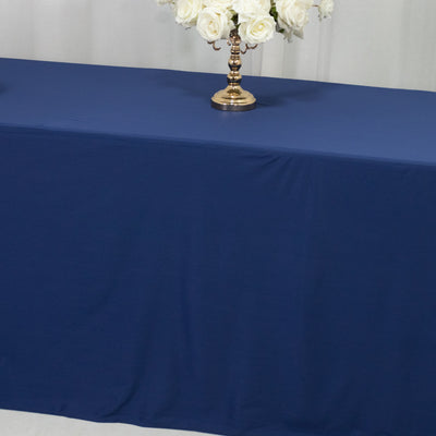 Navy blue tablecloth draped elegantly over a table with floral centerpiece.