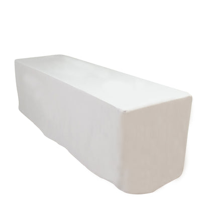 White table cover draped over a rectangular table.