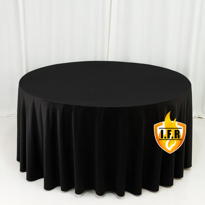 Black round tablecloth on white studio backdrop