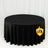 Black round tablecloth on white studio backdrop