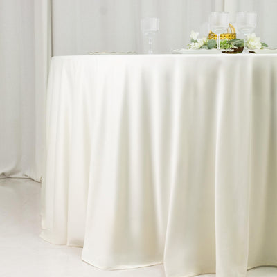 White round tablecloth on styled dining table