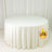 White round tablecloth on display table in studio