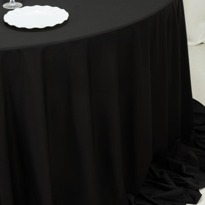 Close-up of black tablecloth drape on round event table