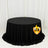 Black round tablecloth on draped table in white room