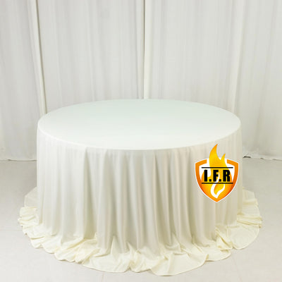 Round white table with a draped tablecloth for events and gatherings.
