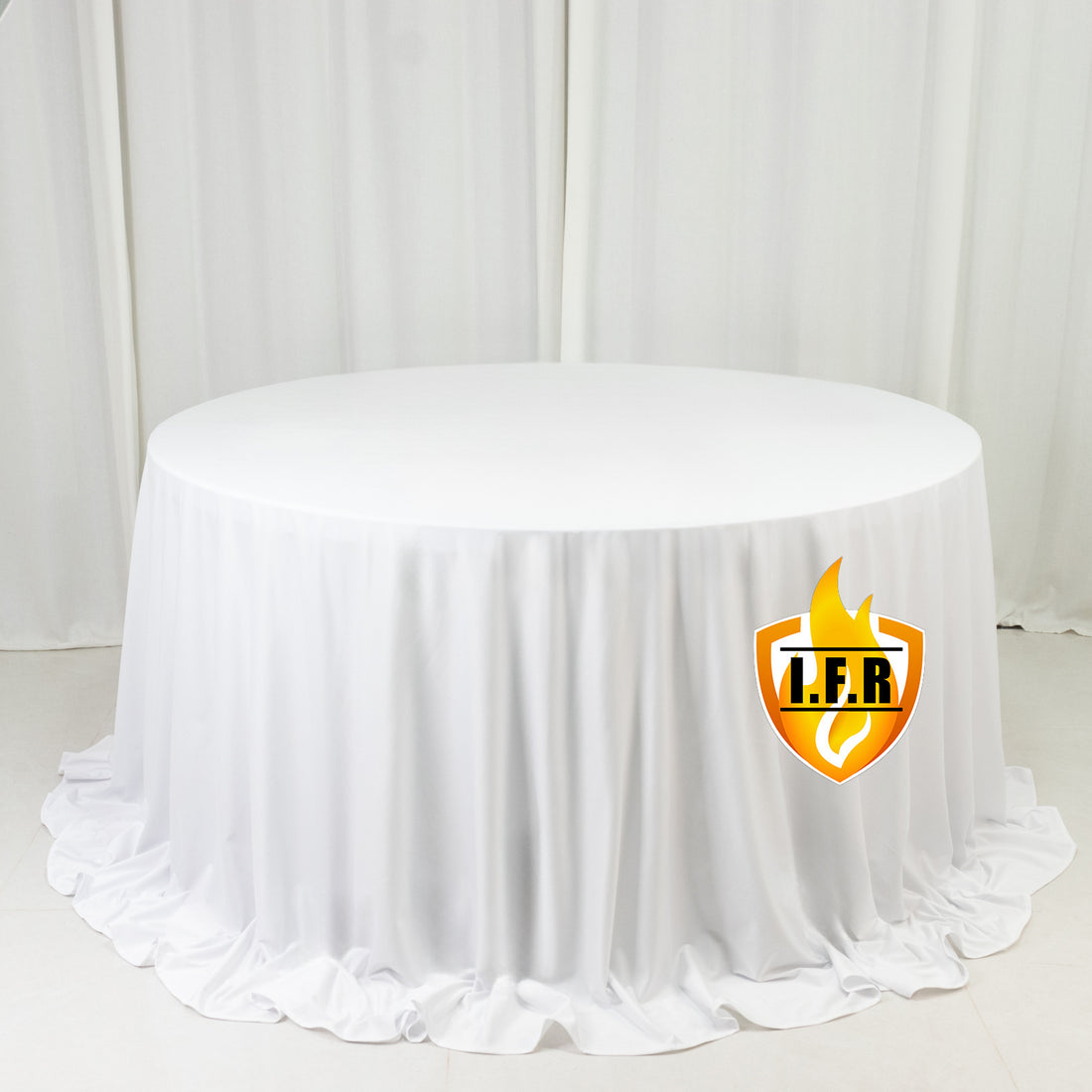 White round fire-retardant tablecloth on table in studio