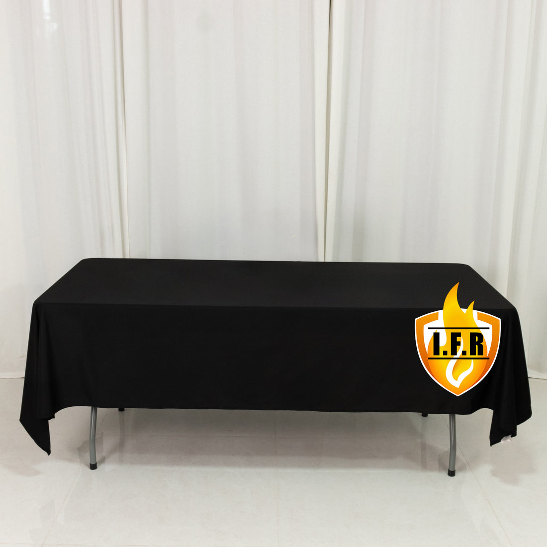 Black table cover with I.F.R. logo on a plain backdrop.