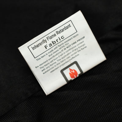 Inherently flame retardant fabric label close-up showing care instructions.