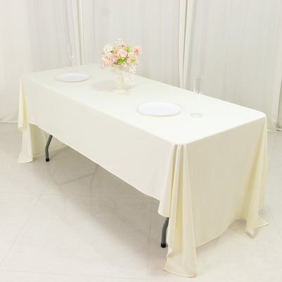 Elegant dining table set with floral centerpiece and plates.
