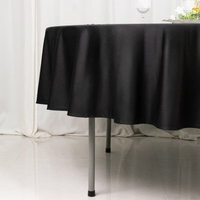 Black tablecloth draping elegantly over a table edge.