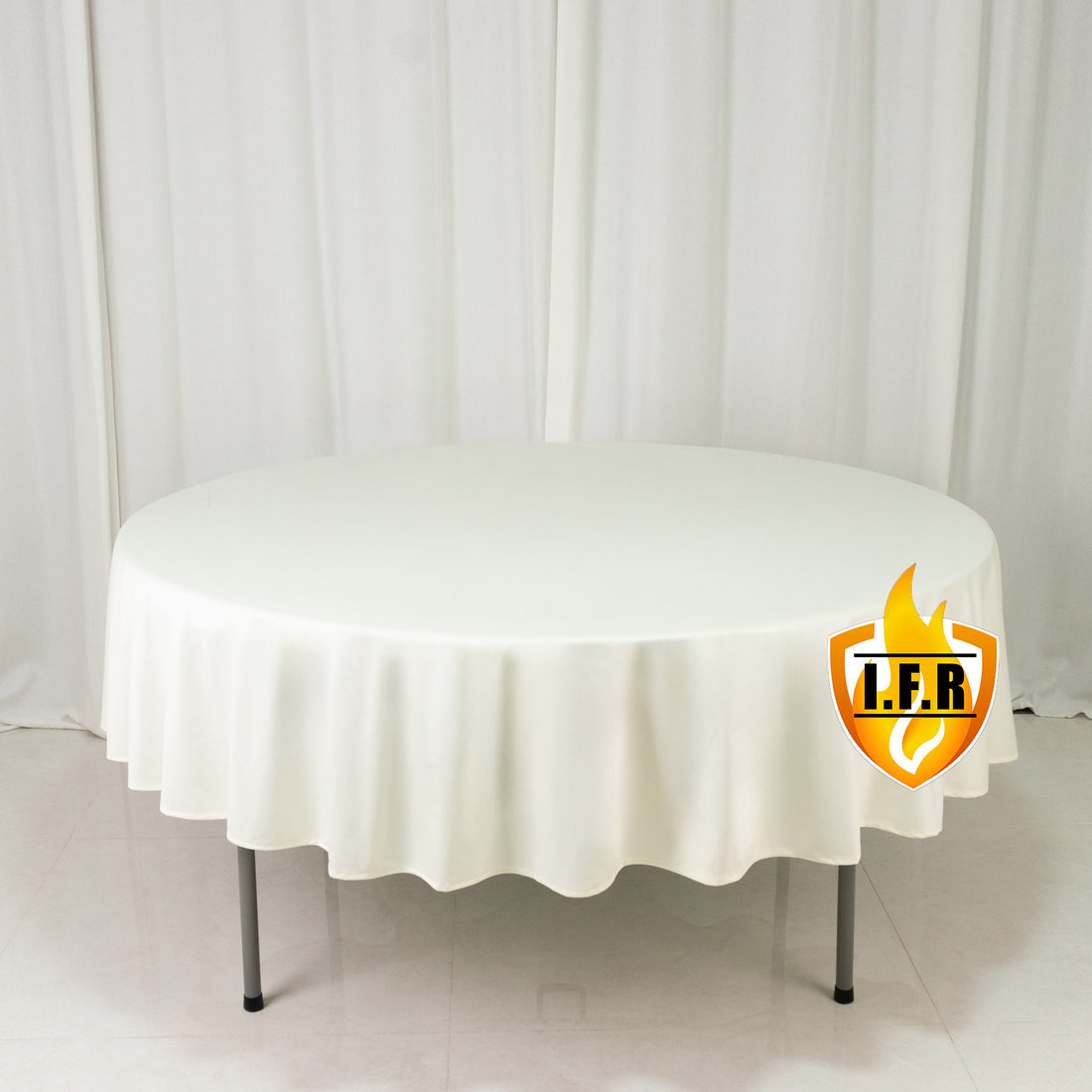 White round tablecloth on display table in studio