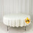 White round tablecloth on display table in studio