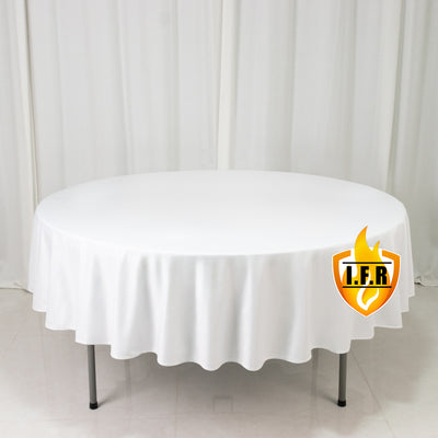 White round banquet table with floor-length tablecloth