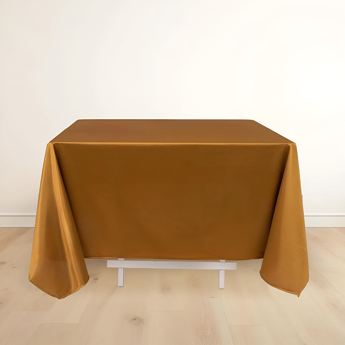 Gold tablecloth draped elegantly over a table