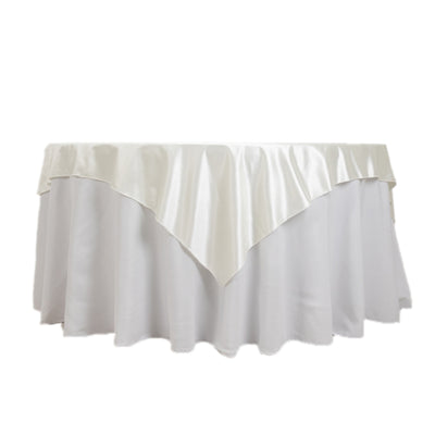 White tablecloth with satin overlay for elegant table settings