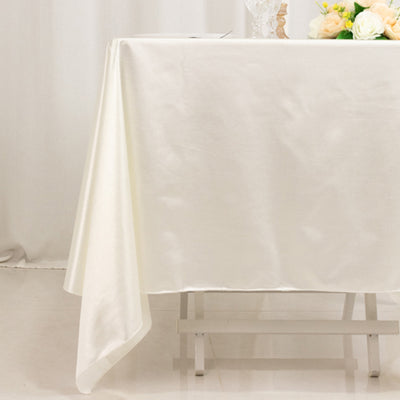 White tablecloth draped elegantly over a table.