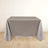 Gray tablecloth draped over a table in a studio setting