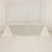 Elegant white table with draped satin cloth, perfect for events or displays.