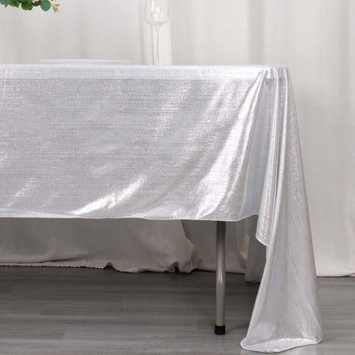 Shiny silver tablecloth draping elegantly over a table.