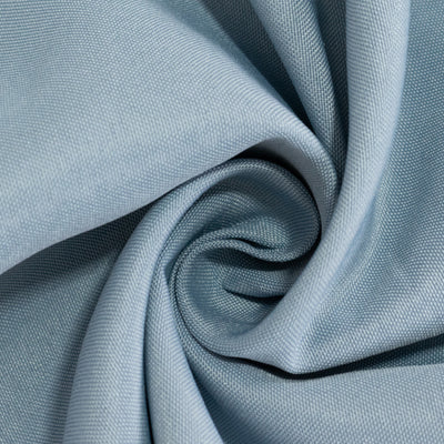 Soft blue fabric with a smooth texture, elegantly twisted in a spiral arrangement.
