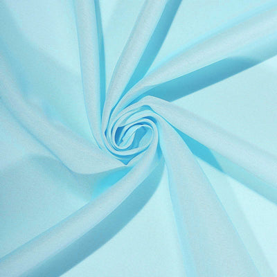 Light blue fabric with a smooth texture, elegantly arranged in a spiral pattern.