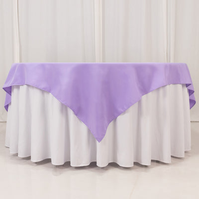 Purple tablecloth draped elegantly over a white table.