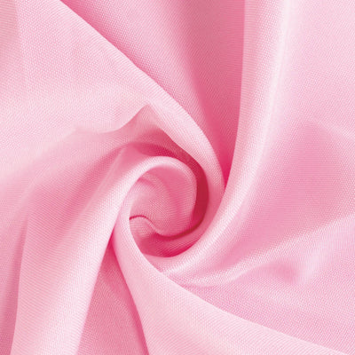 Pink textured fabric swirl close-up for various design projects.
