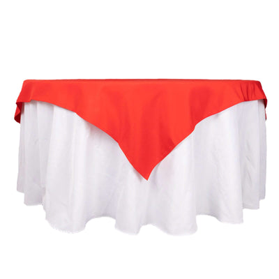 Red tablecloth with white skirt, perfect for events and dining.