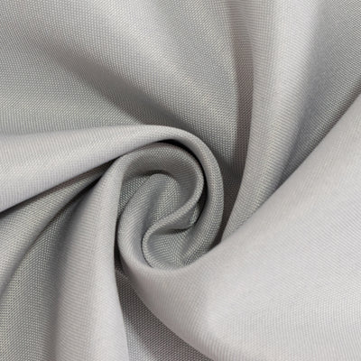 Silver fabric texture in a spiral pattern.