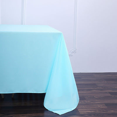 Aqua tablecloth draping elegantly over a table edge.