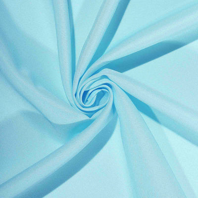 Light blue fabric with a smooth texture, elegantly twisted.