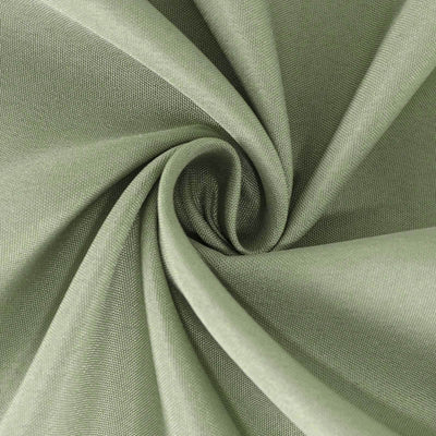 Green fabric texture with a swirling pattern.