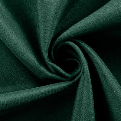 Dark green fabric swirl texture close-up for design use.