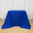 Blue tablecloth draped over a rectangular table in a studio setting