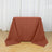 Brown tablecloth draped over a table in a studio setting.