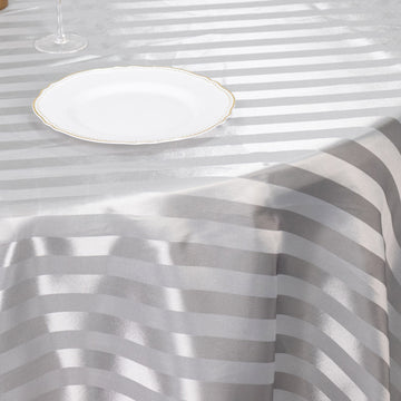 Elevate Your Event with the Silver Satin Stripe Seamless Round Tablecloth 120