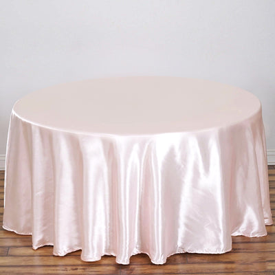 Round satin tablecloth in soft pink color.