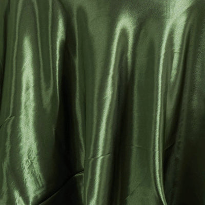 Shiny dark green satin fabric draped elegantly.